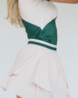 The "Rowie Skirt" is a versatile and timeless wardrobe essential for women. It features a flattering striped elastic waistband and a double-layered design that adds elegance and comfort. Made from stretchy, breathable fabric, this skirt allows for ease of movement, whether on the golf course or during casual outings. A stylish choice for any occasion.