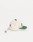 White cap with green brim and logo on a white background