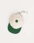 White cap with green brim and logo on a white background