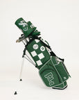 Green golf bag with club head cover on a white background