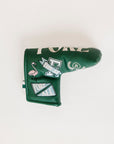 Green golf club head cover with decorative patterns on a white background