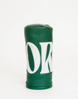Green golf club head cover with a white logo on a white background