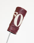 Merlot golf club head cover with a white 'FORE' logo on a white background
