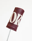 Merlot golf club head cover with a white 'FORE' logo on a white background