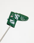 Green golf club head cover with decorative patterns on a white background