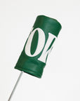 Green golf club head cover with a white logo on a white background