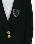 Black blazer with a crest and gold buttons on a white background