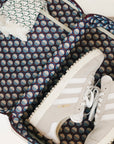 Colorful geometric-patterned Fore All shoe bag on a white background