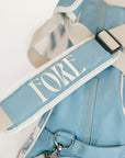 Striped Boston bag with 'FORE' text on a white background
