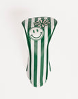 Green and white striped golf club head cover with smiley face and flower design on a white background