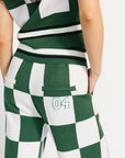 Green and white checkered outfit with a number 04 on a plain background