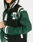 Green and black varsity jacket with white accents on a plain background