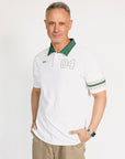 Man wearing a white polo shirt with green accents and '04' on a white background