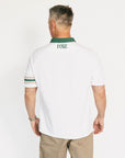 Man wearing a white polo shirt with green accents and 'FORE' branding on a white background