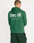 Person wearing a green hoodie with 'Fore All' text on the back, standing against a white background