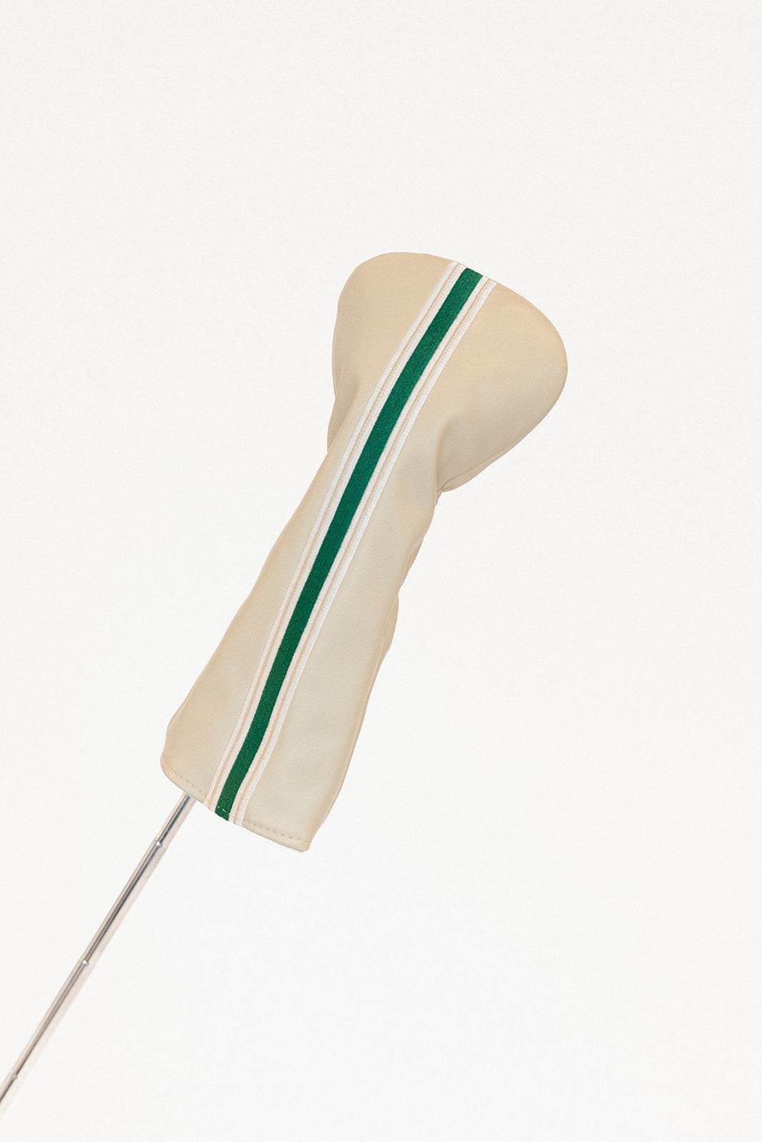 Beige golf club head cover with green stripe on a white background