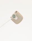 Beige quilted mallet cover with a green logo on a white background