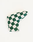 Checkered green and white golf club head cover on a white background