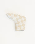 Patterned golf club head cover on a white background