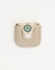 Beige quilted mallet cover with a green logo on a white background