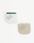 Two mallet covers with a smiley face design on a white background