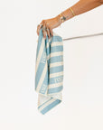 Striped towel with 'FORE' text on a white background