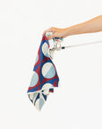 Hand holding a retro golf towel over a white background