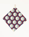 Golf towel with geometric pattern hanging on a white background