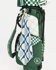 Green golf bag with a patterned towel and club head cover on a white background