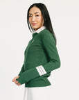 Woman wearing a green Dorothy sweater with a white collar against a white background