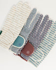 Set of patterned gloves with a small patch on a white background