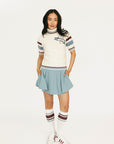 Smoke blue Manhattan skirt worn by a person on a white background