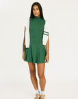 Green manhattan skirt worn by a person on a white background
