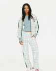 Person wearing a smoke blue and white plaid Lyla Jacket on a white background