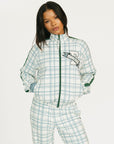 Person wearing a smoke blue and white plaid Lyla Jacket on a white background