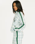 Person wearing a smoke blue and white plaid Lyla Jacket on a white background