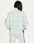 Person wearing a smoke blue and white plaid Lyla Jacket on a white background