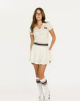 Angora Brooklyn skirt with a colorful waistband and 'Fore All' brand logo on a white background