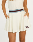 Angora Brooklyn skirt with a colorful waistband and 'Fore All' brand logo on a white background