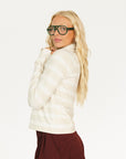 Woman wearing an angora and white Lottie Mock Neck with the Eleanor short in merlot.