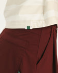 Woman wearing an angora and white Lottie Mock Neck with the Eleanor short in merlot.