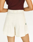 Person wearing a burgundy sleeveless Manhattan top and an angora Eleanor short on a plain background