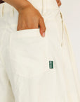 Person wearing a burgundy sleeveless Manhattan top and an angora Eleanor short on a plain background