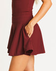 Merlot Marie long-sleeve top and Manhattan skirt on a white background