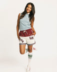 Person wearing the Fore All Fletcher short in merlot with branding on a plain background