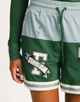 Green Fletcher athletic shorts with Fore All logos on a plain background