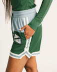 Green Fletcher athletic shorts with Fore All logos on a plain background
