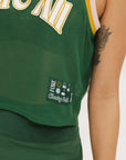 This image features the "Ace Tank Top" in a vibrant green color, highlighted by its sporty and breathable design. The tank top is sleeveless, emphasizing a casual yet athletic style suitable for various activities.