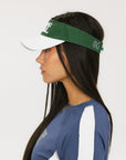 A model wearing a green and white visor with the text 'FORE' across the front and '04' on the back.