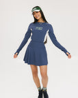 A model wearing a white and green two-toned visor with the word 'FORE' printed on the front.